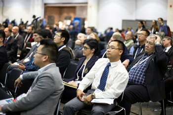 Scientists listen to a presentation.